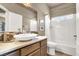 Bright bathroom featuring a modern sink, neutral tones and shower-tub combination at 2102 Rhonda Ter, Henderson, NV 89074