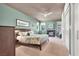 Bedroom with fireplace, ceiling fan and view of the backyard at 2102 Rhonda Ter, Henderson, NV 89074