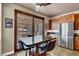 Charming dining area with views of the outdoor patio through sliding glass doors, complete with stainless steel appliances at 2102 Rhonda Ter, Henderson, NV 89074