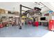Garage with a car lift showcasing a sleek black sports car at 2102 Rhonda Ter, Henderson, NV 89074