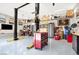 Organized garage featuring a car lift, tool chests, and wall-mounted cabinets at 2102 Rhonda Ter, Henderson, NV 89074