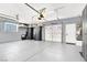 Spacious garage with epoxy flooring, ample storage cabinets, and overhead lighting at 2102 Rhonda Ter, Henderson, NV 89074