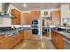 A well-equipped kitchen with stainless steel appliances, custom cabinetry, and granite countertops at 2102 Rhonda Ter, Henderson, NV 89074