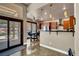 Modern kitchen with stainless steel appliances, a breakfast bar, and access to the outdoor patio at 2102 Rhonda Ter, Henderson, NV 89074