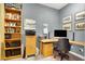 This bright office features custom shelving and a stylish desk setup, perfect for a home workspace at 2102 Rhonda Ter, Henderson, NV 89074