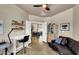 Bright home office with comfortable seating, stylish desk, and ample natural light at 2102 Rhonda Ter, Henderson, NV 89074