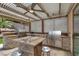 Stylish outdoor kitchen featuring stainless steel grills, a granite countertop island, and barstool seating at 2102 Rhonda Ter, Henderson, NV 89074