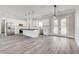 Open concept, bright kitchen featuring stainless steel appliances, white cabinets, and island at 2110 S Manzanita Dr, Pahrump, NV 89048
