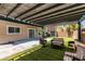 Beautiful backyard with artificial turf, covered patio, and nice patio furniture for outdoor relaxation at 212 Stagecoach Flats, Las Vegas, NV 89031