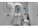 Clean half bathroom with white vanity, stylish mirror, and neutral decor at 212 Stagecoach Flats, Las Vegas, NV 89031