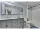 Clean bathroom featuring a double vanity with a large mirror and tub/shower combo with tiled walls at 212 Stagecoach Flats, Las Vegas, NV 89031