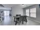 Bright dining room with gray walls, a wood table, and views to other rooms at 212 Stagecoach Flats, Las Vegas, NV 89031