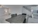Open-concept dining area with sleek wood table and staircase at 212 Stagecoach Flats, Las Vegas, NV 89031