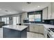 Bright, modern kitchen featuring an island, stainless steel appliances, and exterior access at 212 Stagecoach Flats, Las Vegas, NV 89031