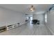 Spacious living area featuring laminate floors, gray walls, dining area and open stairway at 212 Stagecoach Flats, Las Vegas, NV 89031
