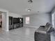 Bright living room with modern entertainment center and gray couch at 212 Stagecoach Flats, Las Vegas, NV 89031