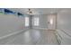 Bright living room with grey walls, light laminate flooring, modern lighting and a front door at 212 Stagecoach Flats, Las Vegas, NV 89031
