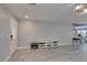 Inviting living room with light laminate floors, grey walls and easy access to the stairway at 212 Stagecoach Flats, Las Vegas, NV 89031