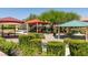 Community playground with picnic tables, playground equipment, and lush landscaping at 212 Stagecoach Flats, Las Vegas, NV 89031