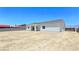 The leveled lot features a large backyard with an expansive dirt lot for customized landscaping at 2150 S Manzanita Dr, Pahrump, NV 89048