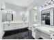 A bathroom with marble counters, double sinks, vanity and a view of the shower at 2150 S Manzanita Dr, Pahrump, NV 89048