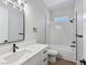 Modern bathroom boasts a quartz countertop, bathtub and shower combination, and sleek fixtures at 2150 S Manzanita Dr, Pahrump, NV 89048