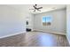 This bedroom has an ensuite bathroom, beautiful natural light, and hardwood floors at 2150 S Manzanita Dr, Pahrump, NV 89048