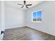 Bright bedroom with natural light and wood-style flooring. Ceiling fan included at 2150 S Manzanita Dr, Pahrump, NV 89048