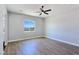 This bedroom has large window allowing natural light to come in and hardwood floors at 2150 S Manzanita Dr, Pahrump, NV 89048
