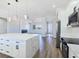 Open kitchen boasts a central island, modern appliances, and seamless flow to the living area at 2150 S Manzanita Dr, Pahrump, NV 89048