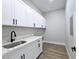 A gorgeous laundry room with counter space and cabinets above the washer/dryer at 2150 S Manzanita Dr, Pahrump, NV 89048