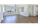 Inviting living room boasts abundant natural light, wood floors, and modern fireplace at 2150 S Manzanita Dr, Pahrump, NV 89048