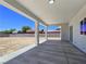 Covered patio features a concrete floor and overlooks the spacious backyard at 2150 S Manzanita Dr, Pahrump, NV 89048