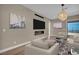 Inviting living room with modern decor, a sleek fireplace, comfortable seating, and scenic views at 2194 Pigeon Hawk St, Las Vegas, NV 89138