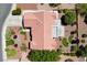 An aerial shot exhibits a tile roofed home complete with putting greens and desert landscaping at 2509 Big Timber Dr, Las Vegas, NV 89134