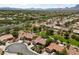 Expansive aerial view of the community featuring tile roofs and desert landscaping at 2509 Big Timber Dr, Las Vegas, NV 89134