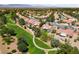 Beautiful aerial view of community homes on a golf course with distant mountain views at 2509 Big Timber Dr, Las Vegas, NV 89134