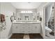 Bathroom with double sinks, vanity, and a glass enclosed shower at 2509 Big Timber Dr, Las Vegas, NV 89134