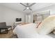Bedroom features a ceiling fan, plush pillows and plenty of natural light at 2509 Big Timber Dr, Las Vegas, NV 89134