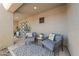 Inviting front porch featuring two comfortable chairs, a small table, and stylish outdoor rug at 2509 Big Timber Dr, Las Vegas, NV 89134