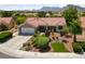 Well maintained single-story home featuring a three-car garage, tile roof, and desert landscaping at 2509 Big Timber Dr, Las Vegas, NV 89134