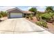 Charming single-story home with a three-car garage, desert landscaping and a spacious driveway at 2509 Big Timber Dr, Las Vegas, NV 89134