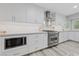Well lit kitchen with stainless steel appliances and white cabinetry at 2509 Big Timber Dr, Las Vegas, NV 89134