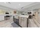Kitchen area with an island, stainless steel appliances, and an adjacent desk area at 2509 Big Timber Dr, Las Vegas, NV 89134