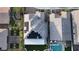 Aerial view of a home showcasing a backyard with artificial turf, a covered patio, and a sparkling pool at 2913 Monate Ct, Henderson, NV 89044
