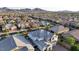 A neighborhood aerial view showcasing many houses with varied architecture and beautiful surroundings at 2913 Monate Ct, Henderson, NV 89044