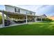 Backyard featuring a covered patio, artificial turf, and space for outdoor dining and recreation at 2913 Monate Ct, Henderson, NV 89044