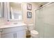 Well-lit bathroom featuring a single vanity, framed art and a glass-enclosed shower at 2913 Monate Ct, Henderson, NV 89044