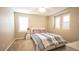 Bedroom featuring a bright window with shutters, plush carpet, and a comfortable bed with stylish bedding at 2913 Monate Ct, Henderson, NV 89044