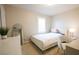 Bright bedroom featuring a comfortable bed, stylish decor, and a window with shutters at 2913 Monate Ct, Henderson, NV 89044